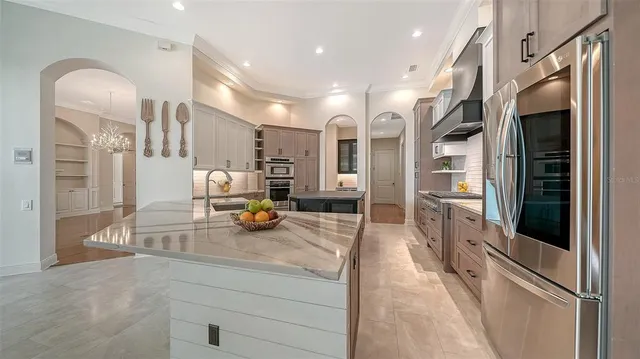 a stove top oven sitting inside of a kitchen