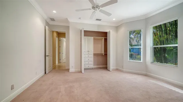 a kitchen with stainless steel appliances kitchen island granite countertop a table and chairs in it