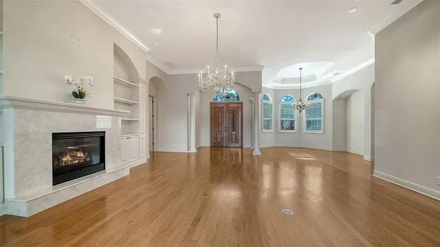 a large room with lots of counter space and windows