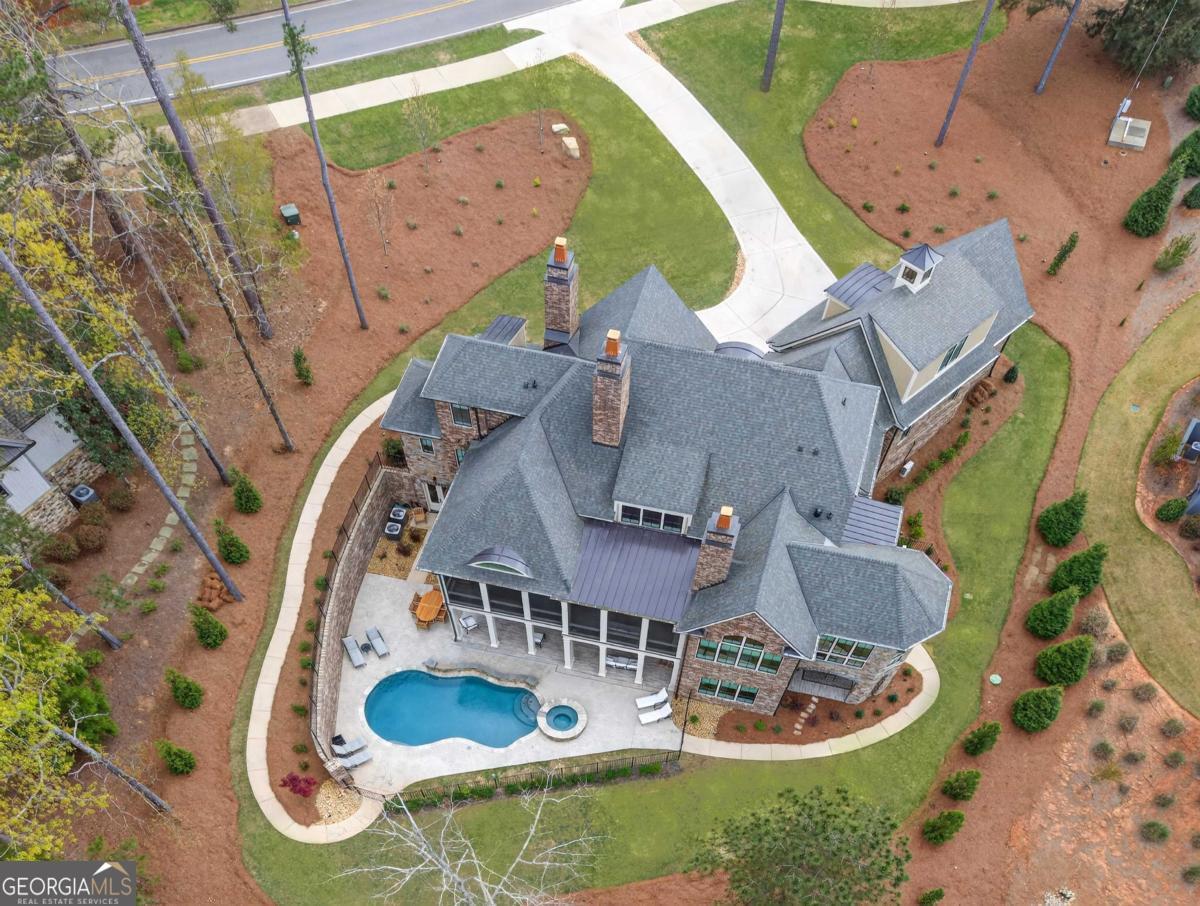 5010 Browns Ford Road Greensboro, GA 30642 - Photo 14 of 67 an aerial view of a house with garden space and swimming pool