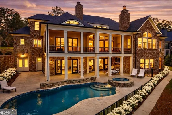 an aerial view of a house having swimming pool