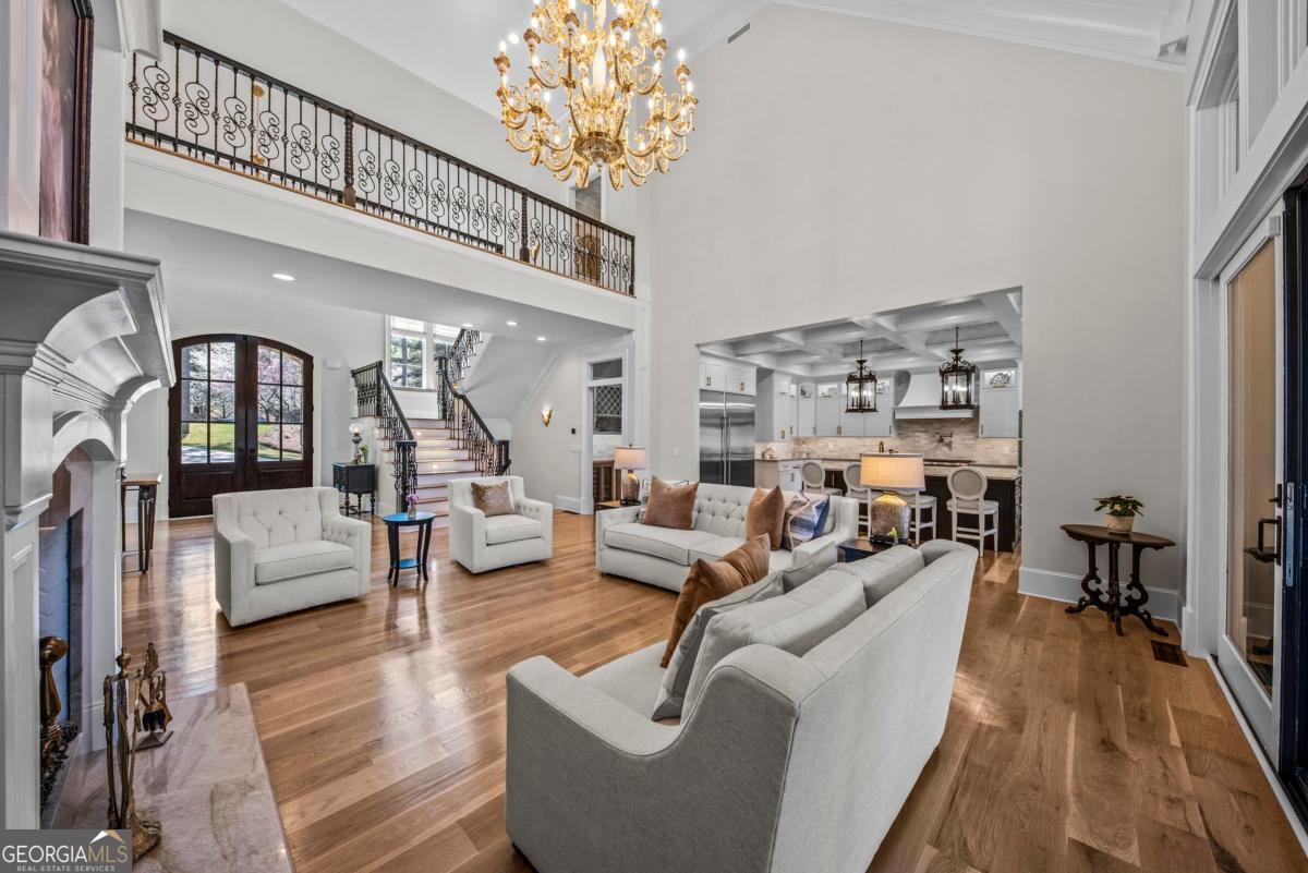 5010 Browns Ford Road Greensboro, GA 30642 - Photo 25 of 67 a living room with furniture and a chandelier
