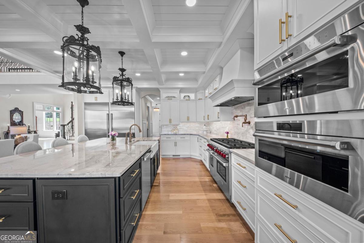 5010 Browns Ford Road Greensboro, GA 30642 - Photo 28 of 67 a kitchen with stainless steel appliances granite countertop a sink and stove