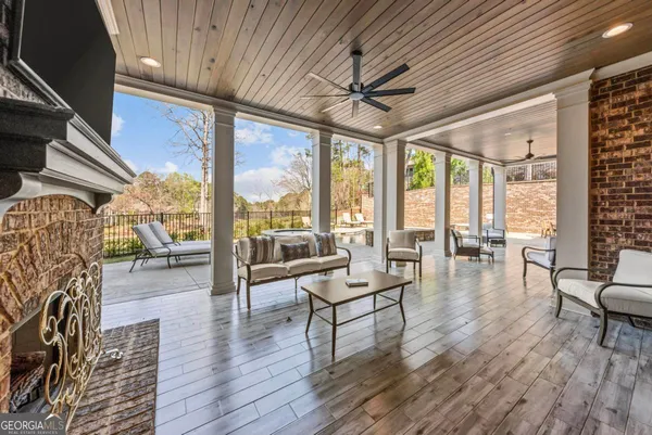 a bathroom with a granite countertop shower sink and mirror