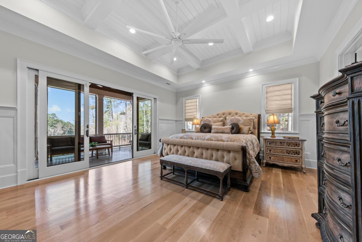 5010 Browns Ford Road Greensboro, GA 30642 - Photo 43 of 67 a bedroom with a bed and wooden floor