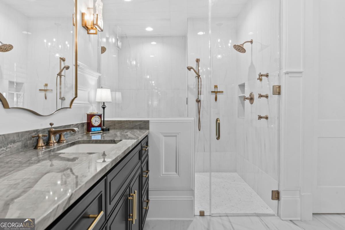 5010 Browns Ford Road Greensboro, GA 30642 - Photo 48 of 67 a bathroom with a granite countertop shower sink and mirror