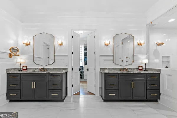 a kitchen with cabinets appliances and a wooden floor