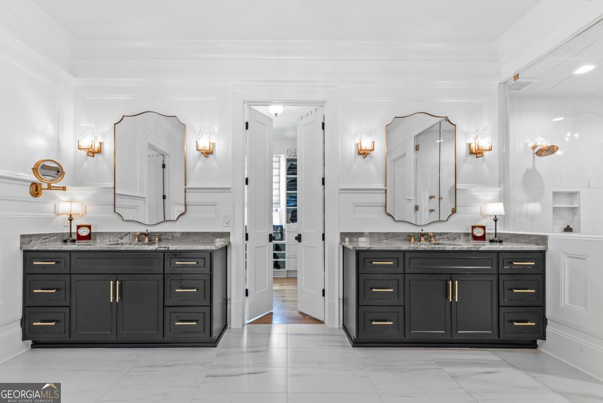 5010 Browns Ford Road Greensboro, GA 30642 - Photo 49 of 67 a spacious bathroom with a granite countertop sink a mirror a vanity and a