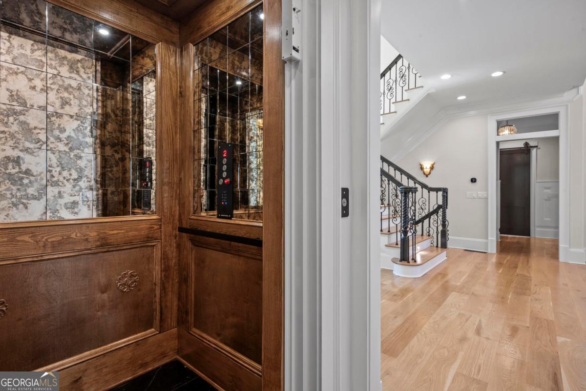 5010 Browns Ford Road Greensboro, GA 30642 - Photo 55 of 67 a view of a hallway with wooden floor