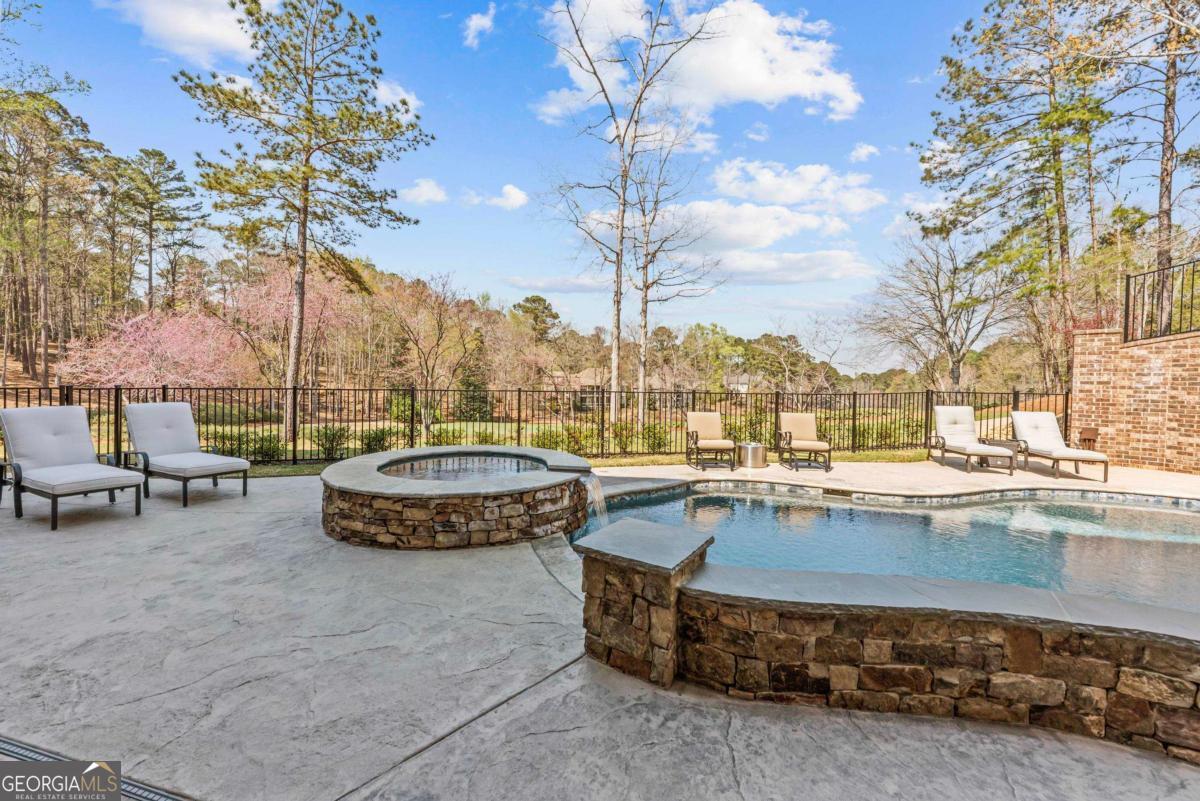 5010 Browns Ford Road Greensboro, GA 30642 - Photo 6 of 67 a view of a swimming pool with a lounge chairs
