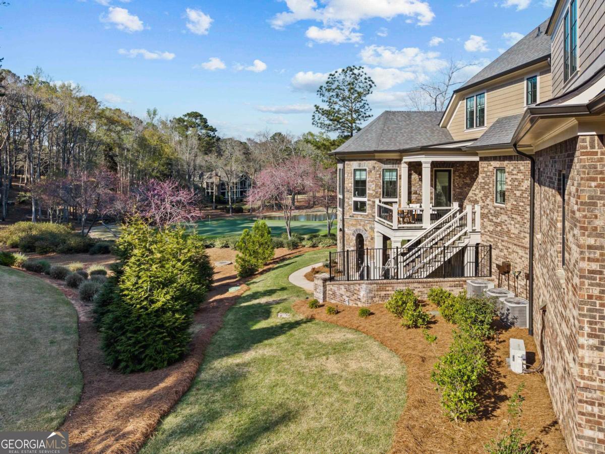 5010 Browns Ford Road Greensboro, GA 30642 - Photo 10 of 67 a view of a house with backyard and sitting area