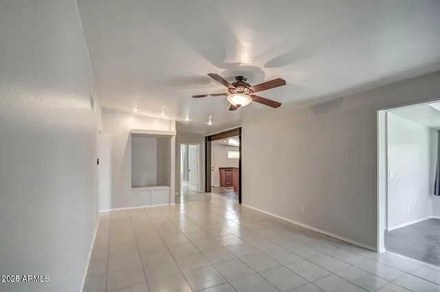 a view of an empty room with a fireplace