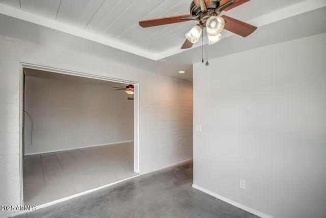 a white toilet sitting next to a shower curtain