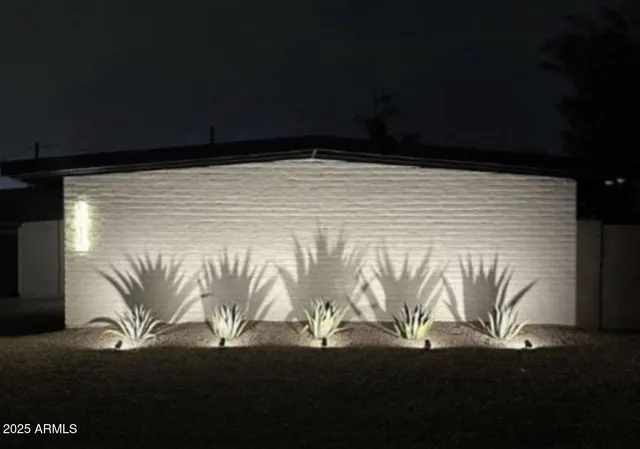 a kitchen with stainless steel appliances granite countertop a sink and a stove