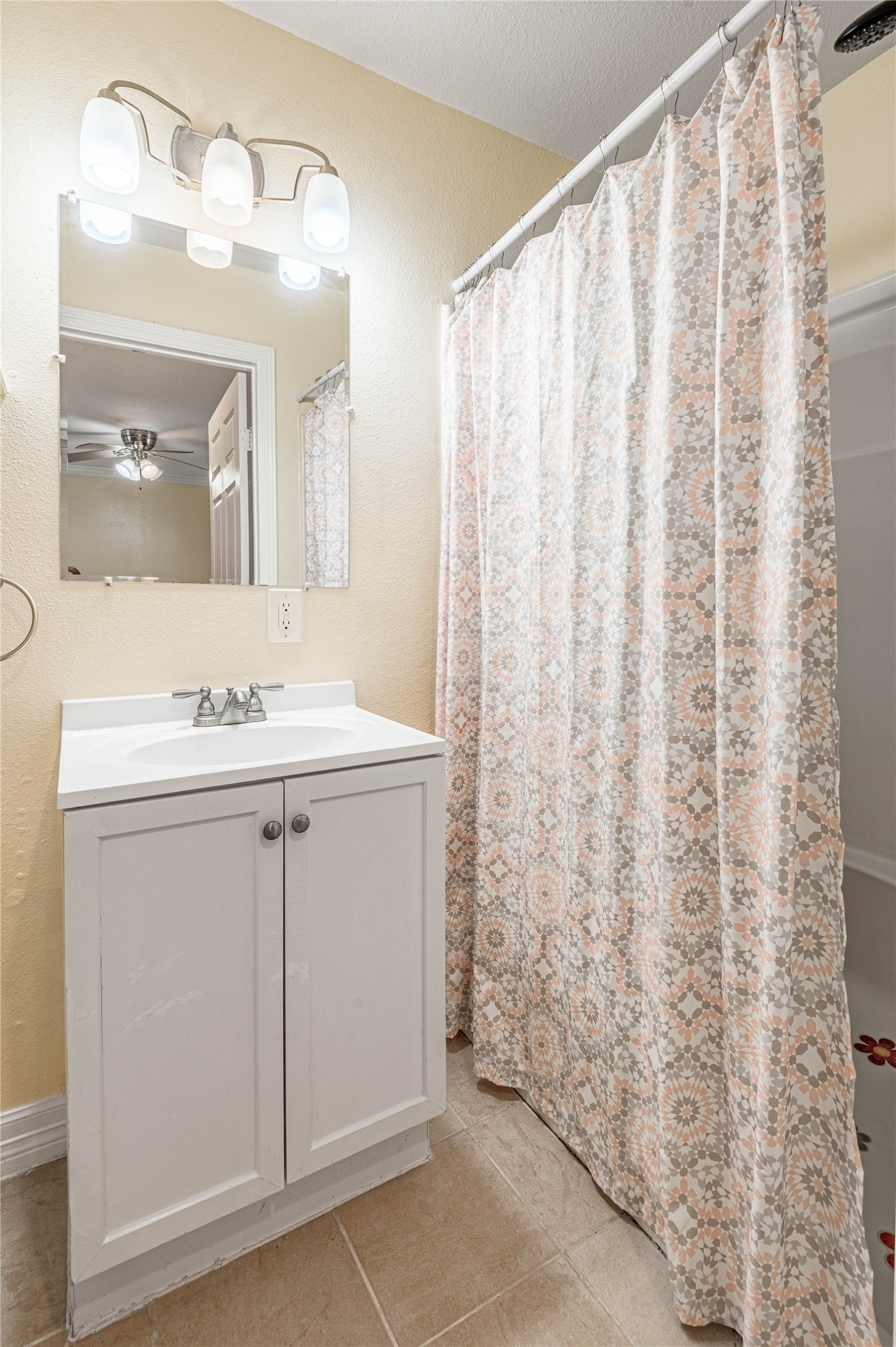 4 Rainbow Drive, Unit A Huntsville, TX 77320 - Photo 12 of 15 a bathroom with a sink vanity and a mirror