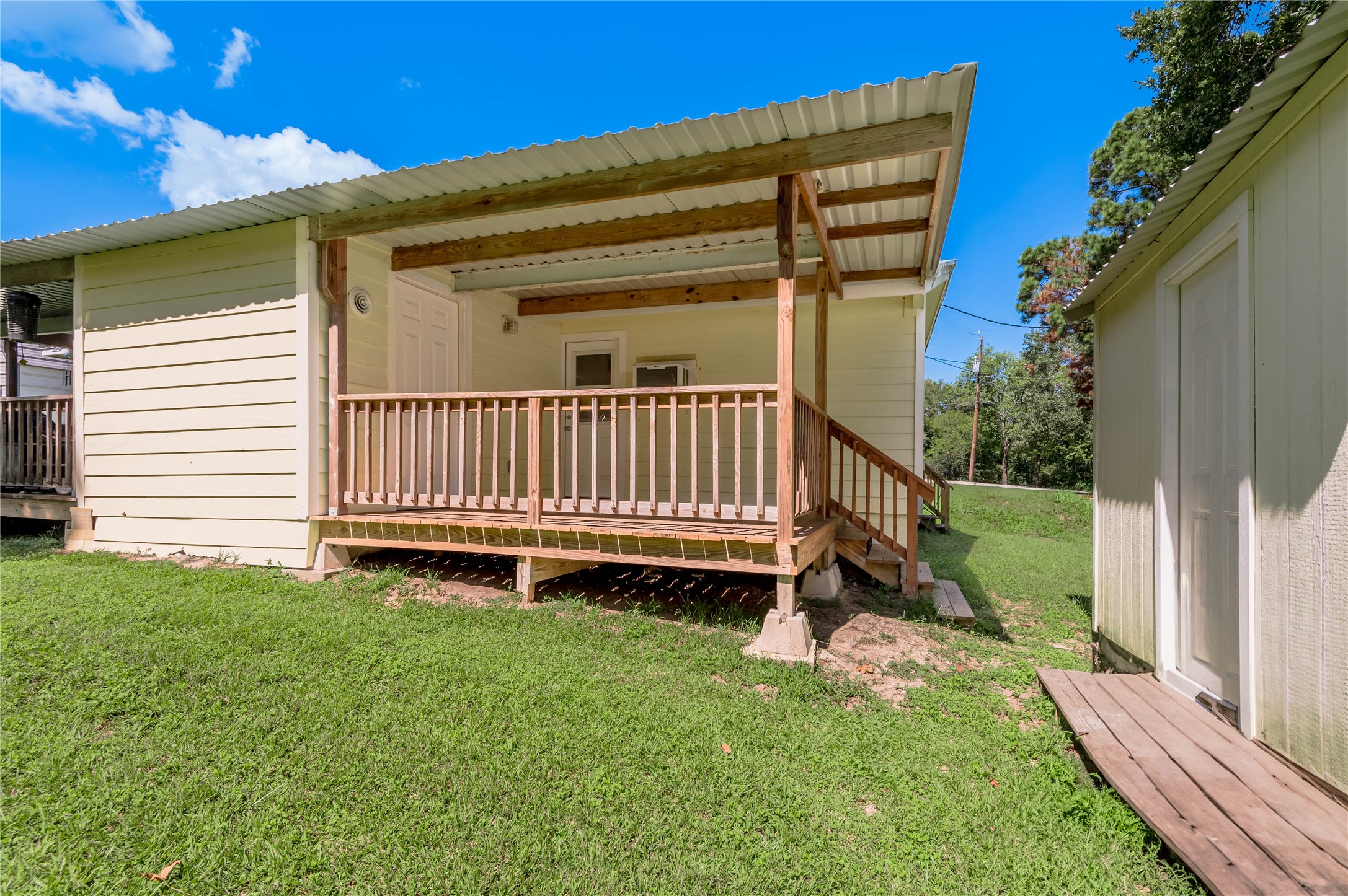 4 Rainbow Drive, Unit A Huntsville, TX 77320 - Photo 15 of 15 a view of a chair in the backyard with wooden fence
