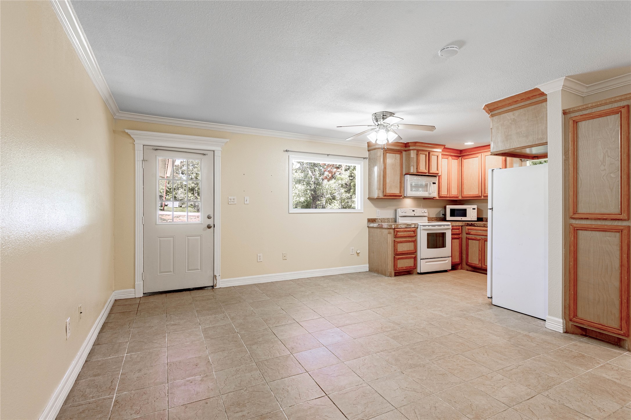 4 Rainbow Drive, Unit A Huntsville, TX 77320 - Photo 7 of 15 a view of a kitchen with refrigerator and windows