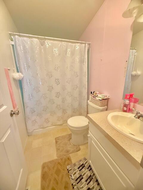 51555 Monroe Street, Unit 101 Indio, CA 92201 - Photo 12 of 18 a bathroom with a sink toilet and shower