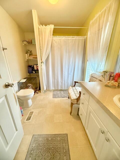 51555 Monroe Street, Unit 101 Indio, CA 92201 - Photo 17 of 18 a bedroom with a bed and a couch
