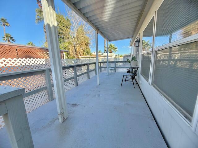 51555 Monroe Street, Unit 101 Indio, CA 92201 - Photo 4 of 18 a view of a porch with furniture