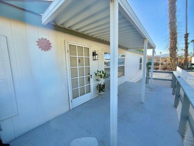 51555 Monroe Street, Unit 101 Indio, CA 92201 - Photo 5 of 18 a view of livingroom with furniture and floor to ceiling window