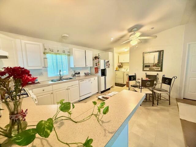 51555 Monroe Street, Unit 101 Indio, CA 92201 - Photo 10 of 18 a living room with granite countertop kitchen island furniture and a chandelier