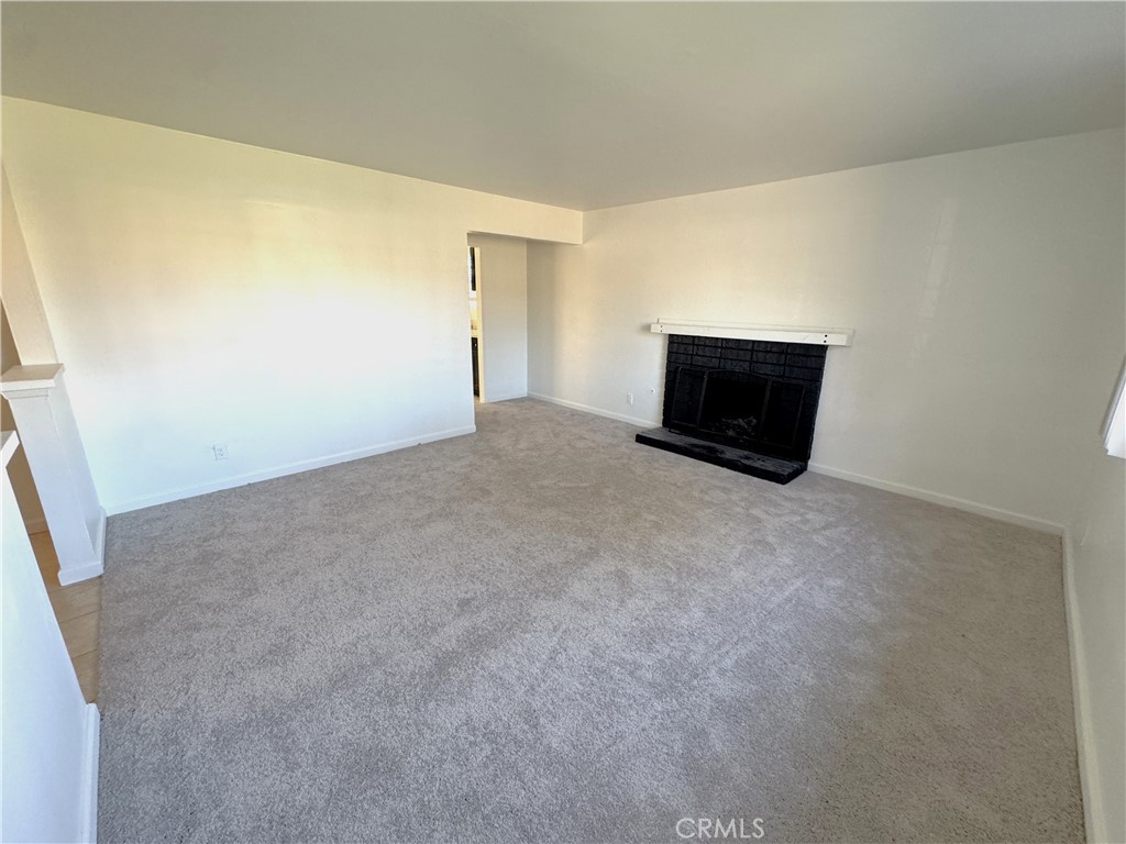 835 East Claude Street Carson, CA 90746 - Photo 4 of 20 a view of a big room with closet and windows