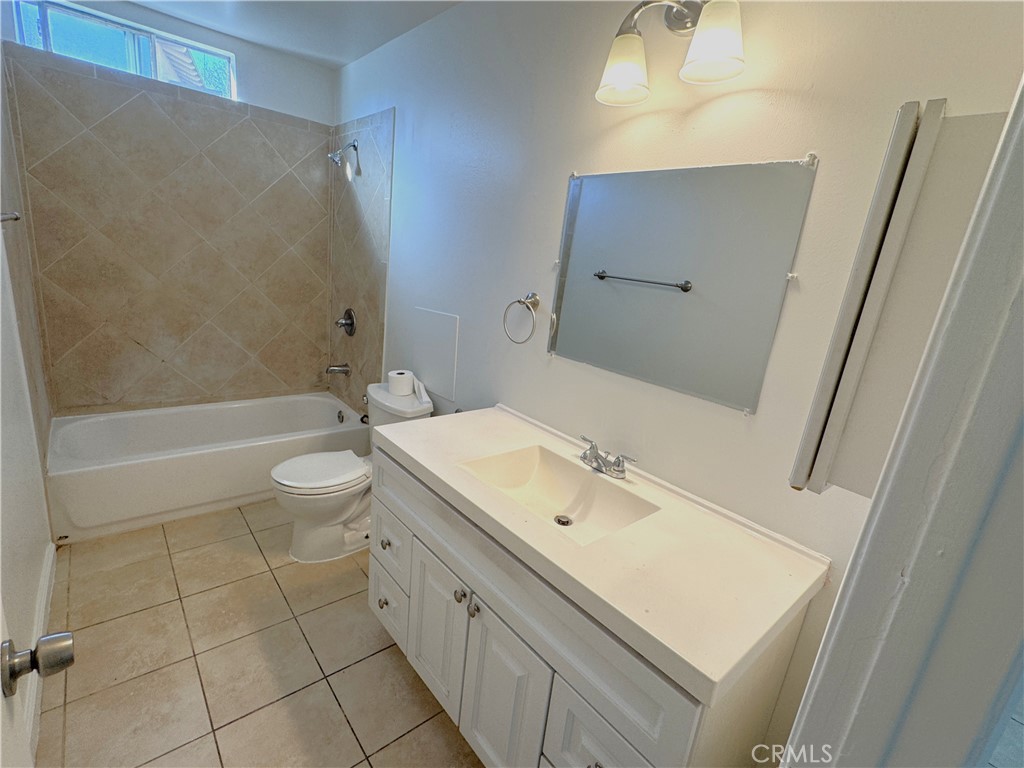 835 East Claude Street Carson, CA 90746 - Photo 8 of 20 a bathroom with a sink a toilet and bathtub