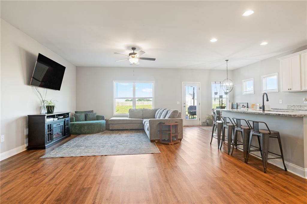 64 Neal Little Road Carnesville, GA 30521 - Photo 4 of 17 a living room with furniture wooden floor and a flat screen tv