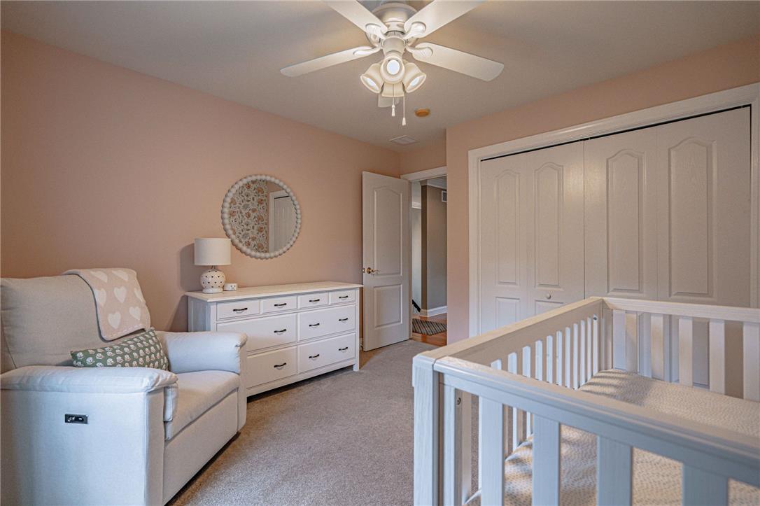 6000 Pond View Terrace Bath, PA 18014 - Photo 42 of 69 Soft carpet flooring and a ceiling fan create a serene and comfortable nursery space.