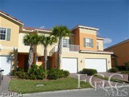 9803 Bodego Way, Unit 104 Fort Myers, FL 33908 - Photo 2 of 10 a front view of a house with garden