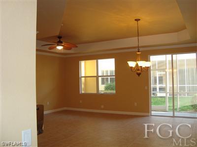 9803 Bodego Way, Unit 104 Fort Myers, FL 33908 - Photo 3 of 10 a view of an empty room with a window