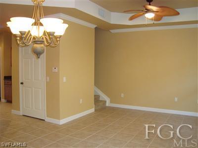 9803 Bodego Way, Unit 104 Fort Myers, FL 33908 - Photo 4 of 10 a view of a livingroom with a chandelier