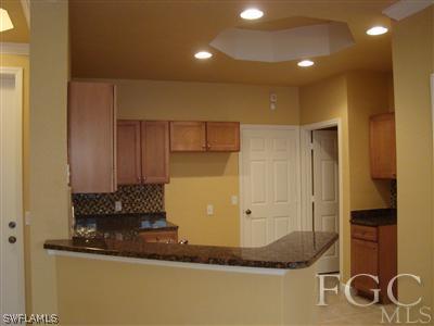 9803 Bodego Way, Unit 104 Fort Myers, FL 33908 - Photo 6 of 10 a bathroom with a mirror