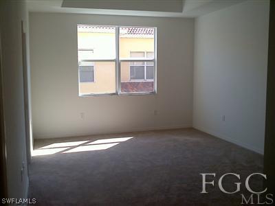 9803 Bodego Way, Unit 104 Fort Myers, FL 33908 - Photo 7 of 10 a view of an empty room with a window