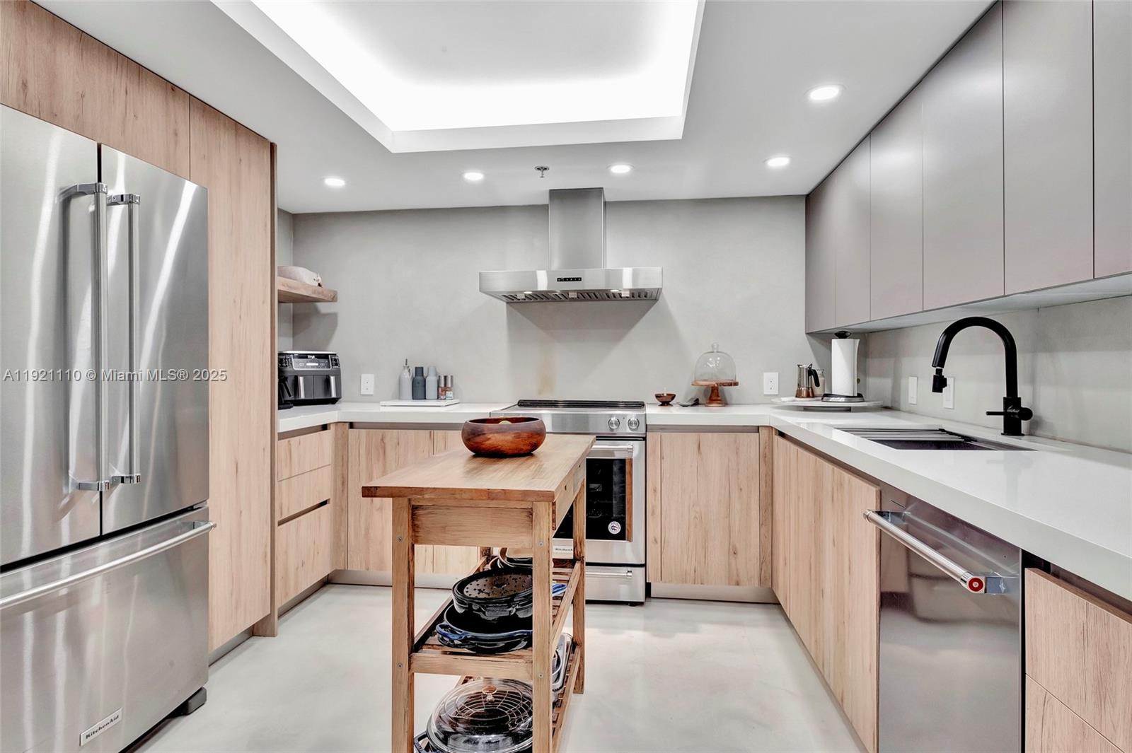 1627 Brickell Avenue, Unit 1202 Miami, FL 33129 - Photo 17 of 30 a kitchen with a sink appliances and cabinets