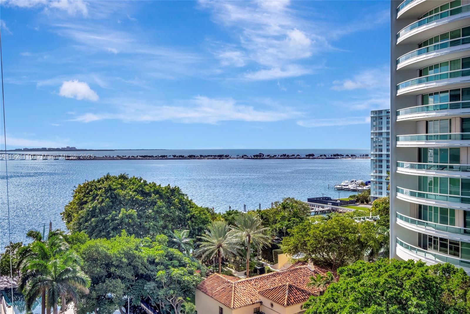 1627 Brickell Avenue, Unit 1202 Miami, FL 33129 - Photo 2 of 30 a view of a lake with a building in front of it