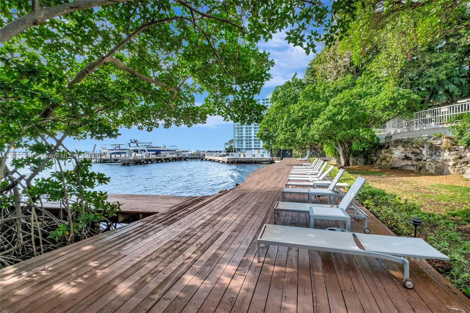 1627 Brickell Avenue, Unit 1202 Miami, FL 33129 - Photo 29 of 30 a view of balcony with wooden floor and seating space