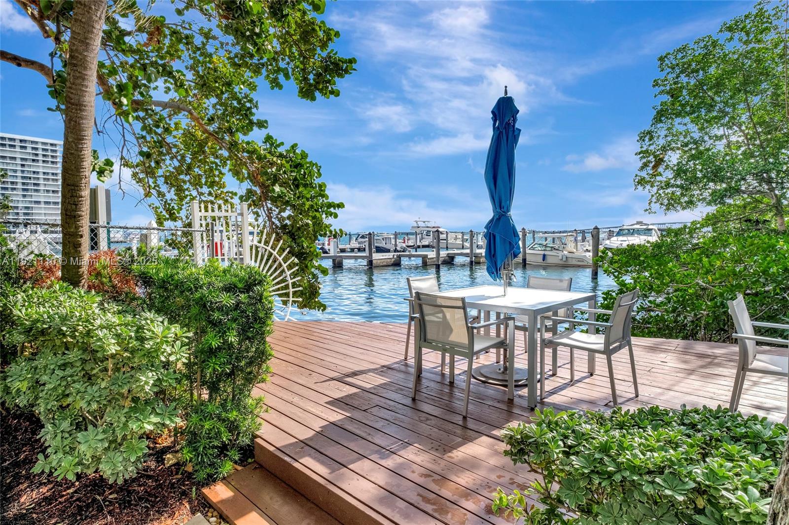 1627 Brickell Avenue, Unit 1202 Miami, FL 33129 - Photo 30 of 30 a view of a chairs with a table and chairs in patio