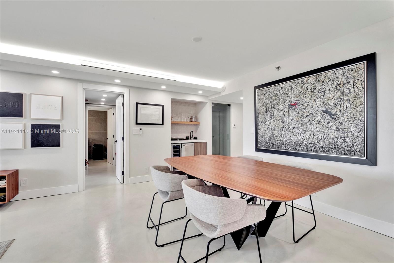 1627 Brickell Avenue, Unit 1202 Miami, FL 33129 - Photo 7 of 30 a view of a dining room with furniture and wooden floor