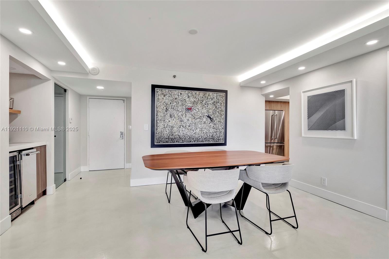1627 Brickell Avenue, Unit 1202 Miami, FL 33129 - Photo 8 of 30 a dining room with furniture and window
