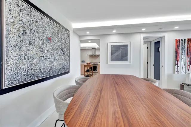 a bedroom with a large bed and a dresser