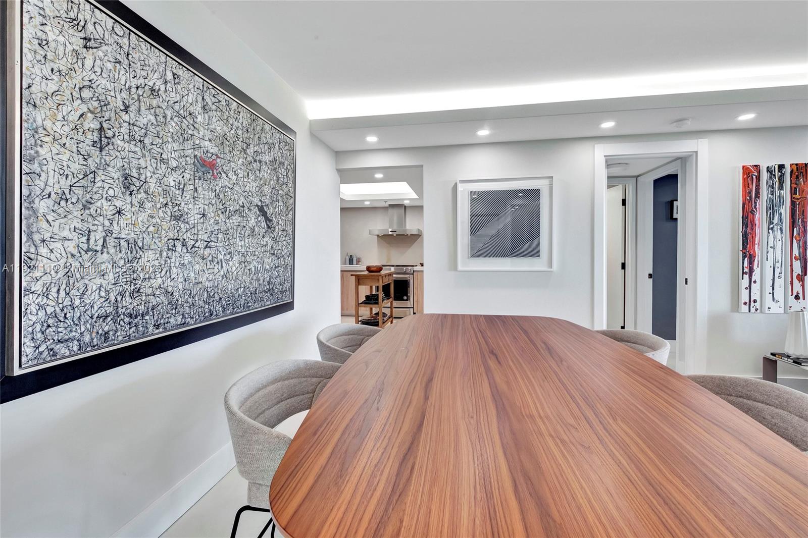 1627 Brickell Avenue, Unit 1202 Miami, FL 33129 - Photo 9 of 30 a bedroom with a large bed and a dresser