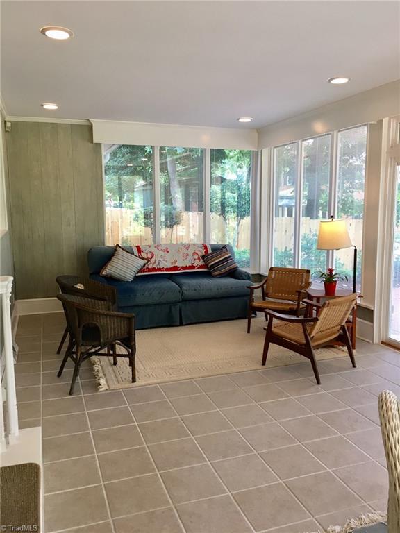 506 Redding Road Asheboro, NC 27203 - Photo 14 of 30 The sunroom is the focal point of this great home! Tile floor, recessed lighting and open views to the patio and back yard.