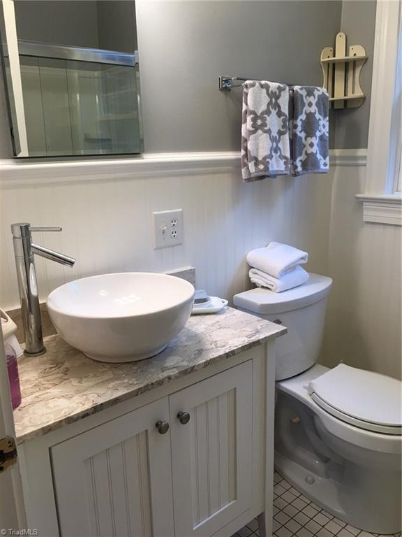 506 Redding Road Asheboro, NC 27203 - Photo 22 of 30 Guest bathroom vanity has an Italian marble top and modern updated feel!