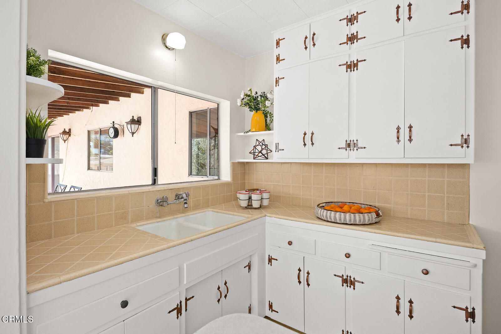 2724 Locksley Place Los Angeles, CA 90039 - Photo 12 of 34 a view of cabinets a sink and dishwasher with wooden floor