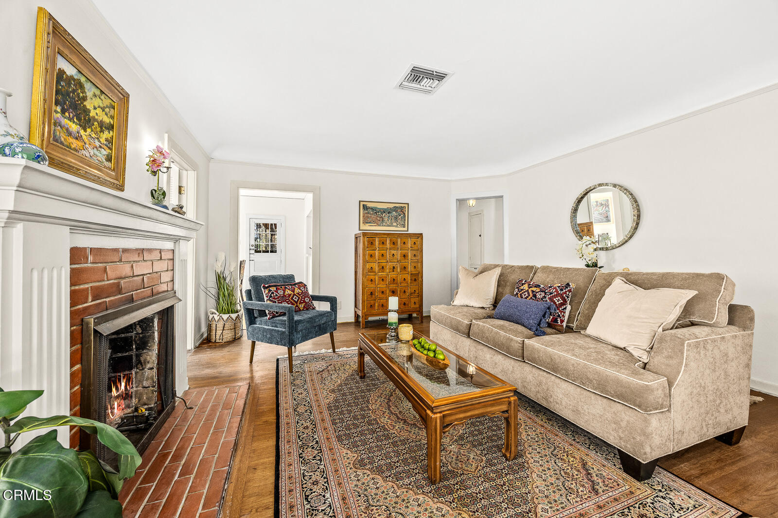 2724 Locksley Place Los Angeles, CA 90039 - Photo 6 of 34 a living room with furniture a fireplace and wooden floor