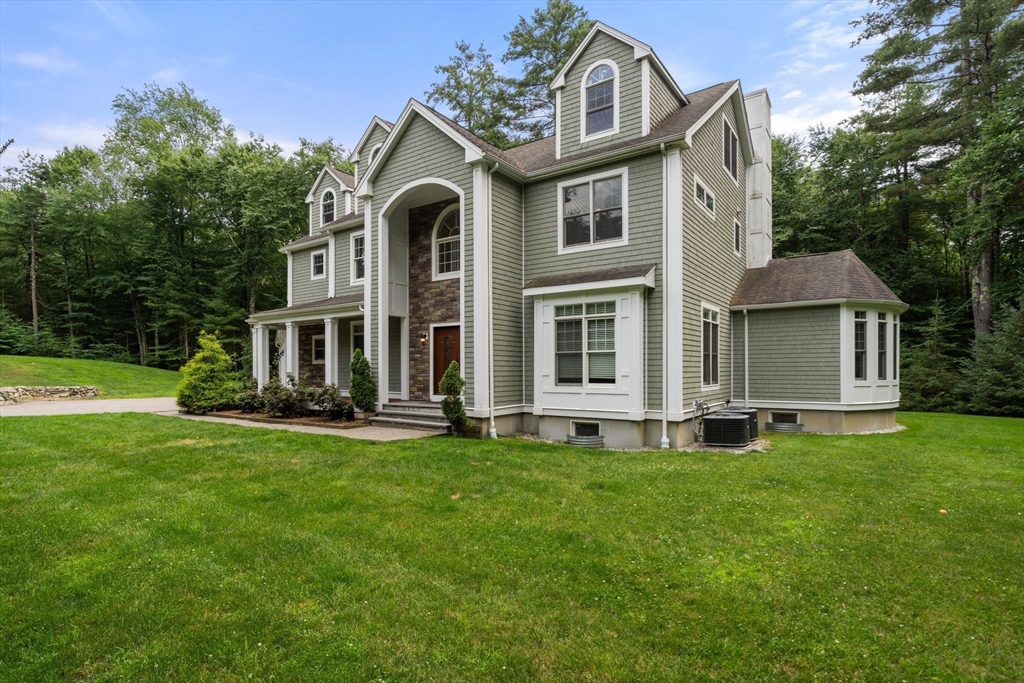 24 Wayside Inn Road Framingham, MA 01701 - Photo 3 of 38 a front view of a house with a yard