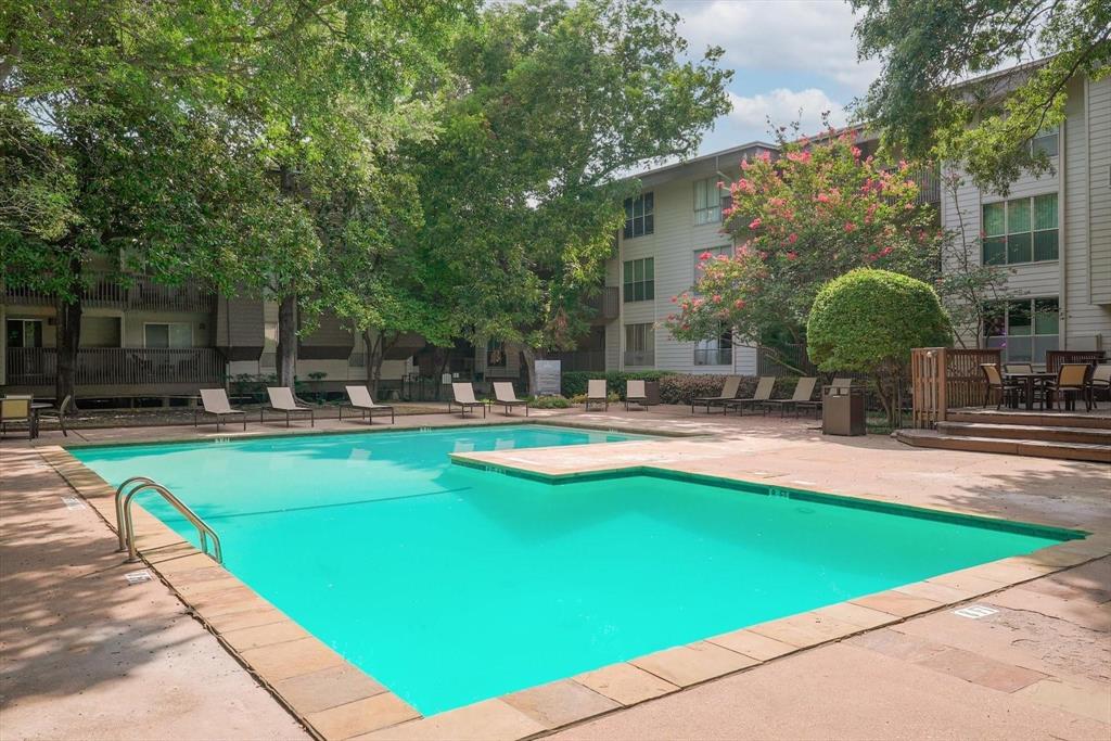 4851 Cedar Springs Road, Unit 391 Dallas, TX 75219 - Photo 14 of 14 a swimming pool with outdoor seating and yard