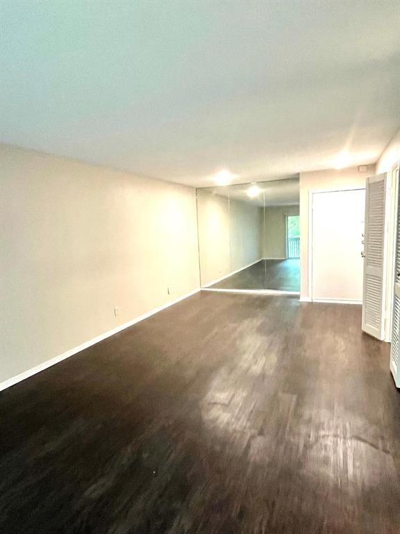 4851 Cedar Springs Road, Unit 391 Dallas, TX 75219 - Photo 2 of 14 a view of empty room with wooden floor